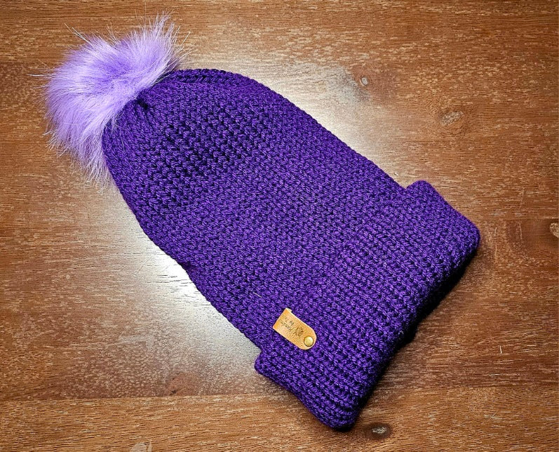 Adult beanies with a brim and pom pom