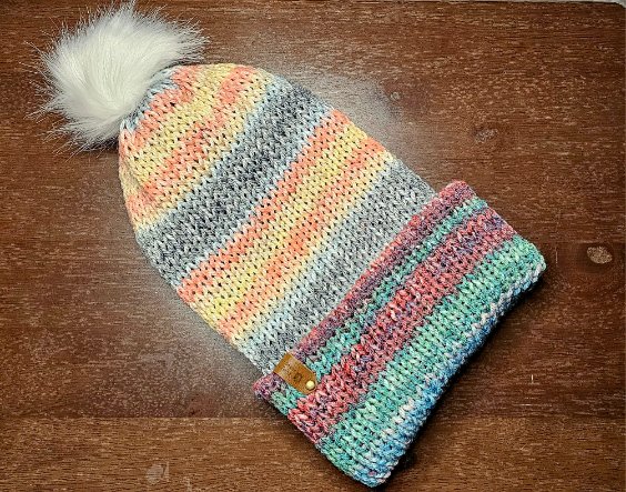 Adult beanies with a brim and pom pom