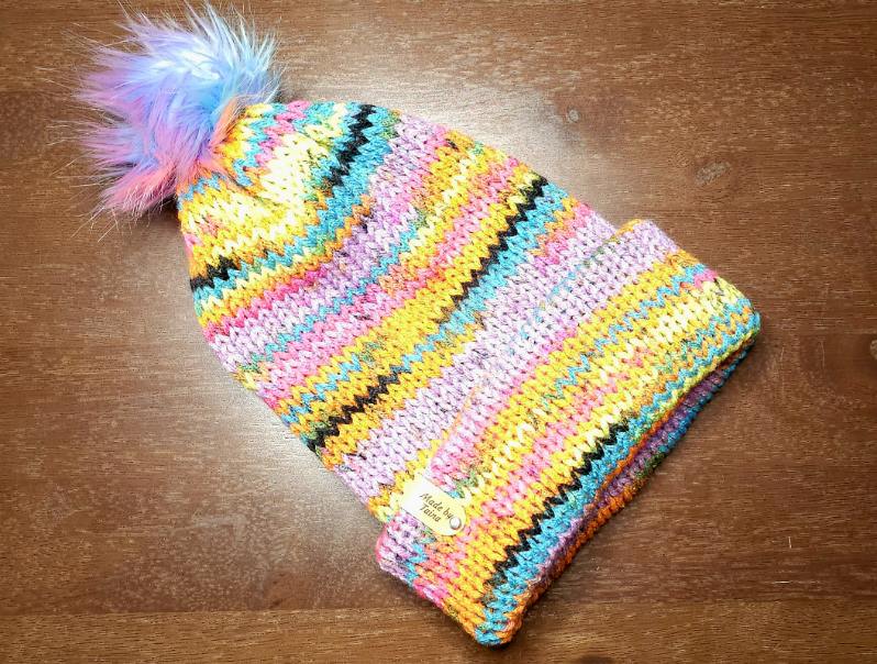 Adult beanies with a brim and pom pom